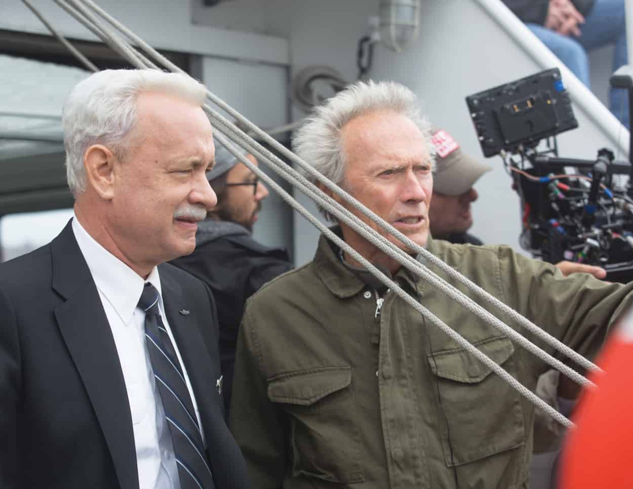 (L-R) Tom Hanks with director/producer, Clint Eastwood on the set of Warner Bros. Pictures’ and Village Roadshow Pictures’ drama SULLY, a Warner Bros. Pictures release. Photo by Keith Bernstein